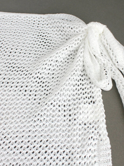 Falda corta con nudo lateral estilo playero chic y moderno