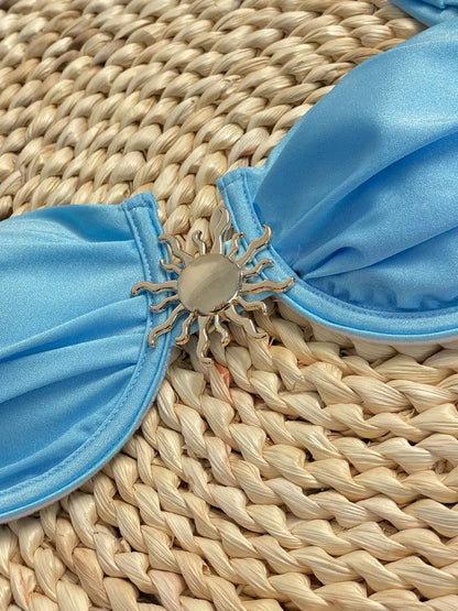 Bikini azul con aro y falda