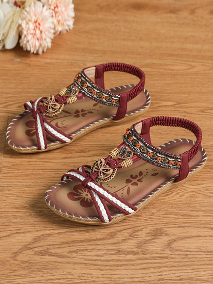 Sandalias boho étnicas con pedrería y tiras cruzadas