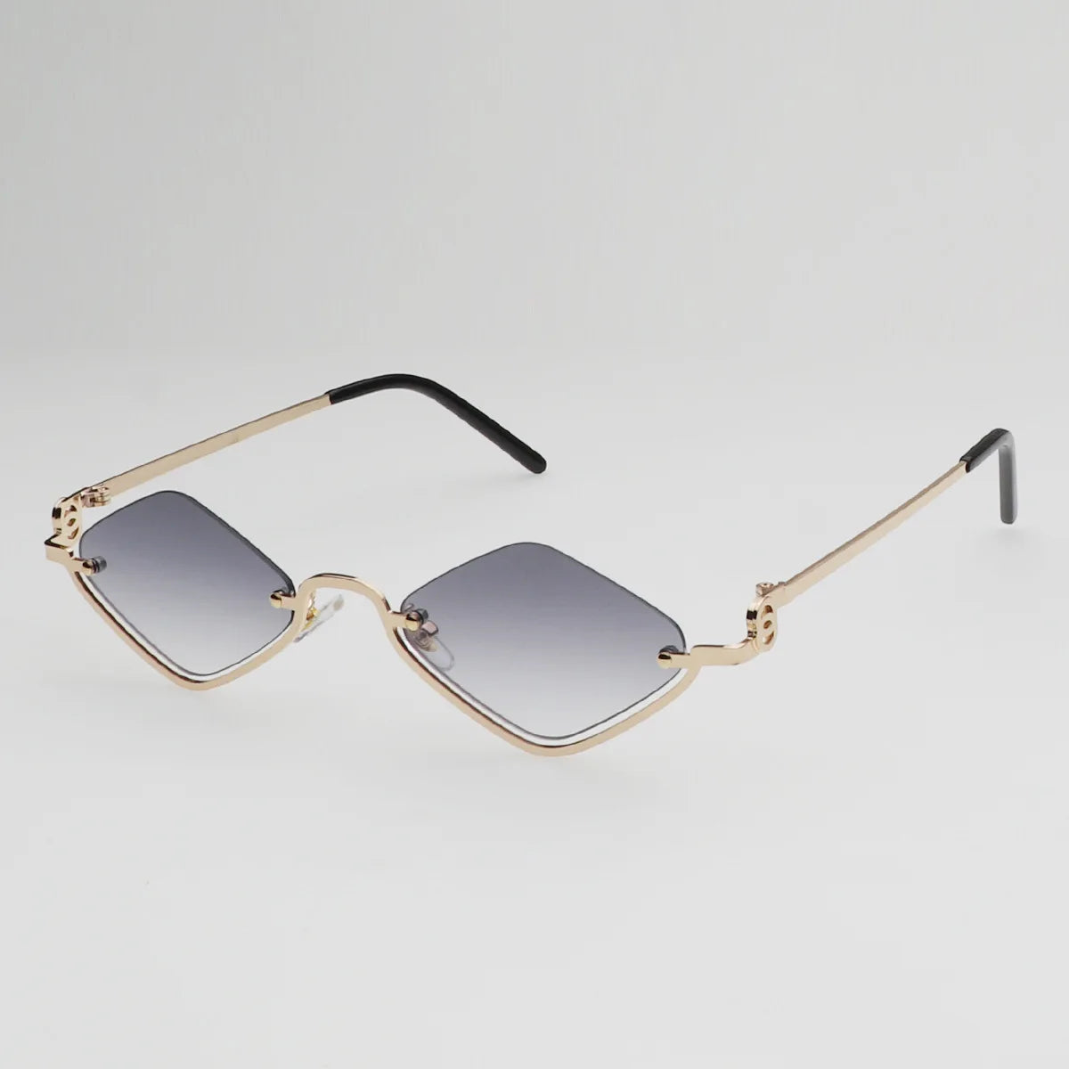 Gafas de sol cat eye con montura dorada