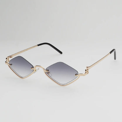 Gafas de sol cat eye con montura dorada