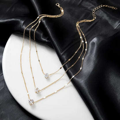 Collar dorado triple con circonias