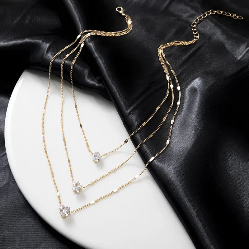 Collar dorado triple con circonias