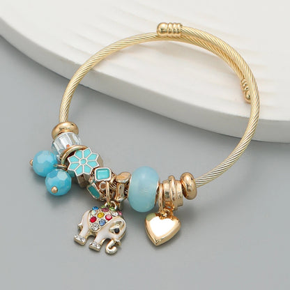 Pulsera de oro con dijes